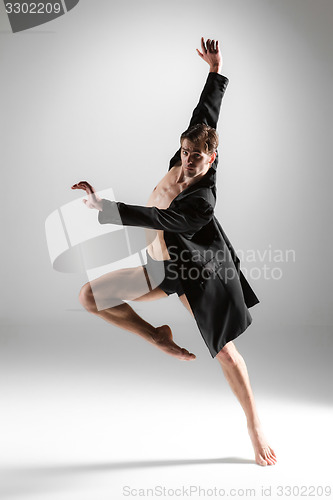 Image of The young attractive modern ballet dancer on white background