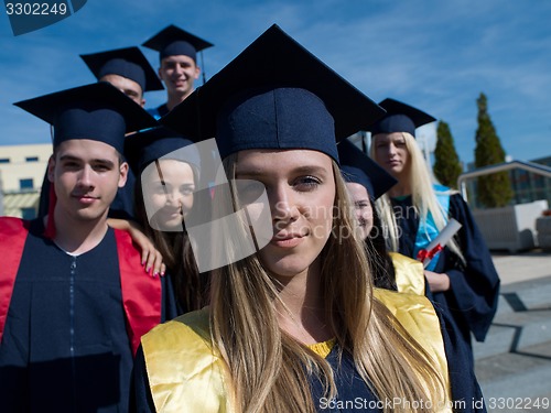 Image of young graduates students group