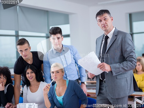 Image of students with teacher  in computer lab classrom