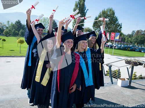 Image of young graduates students group