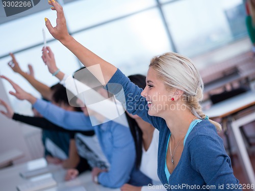 Image of students group raise hands up