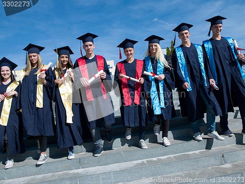 Image of young graduates students group