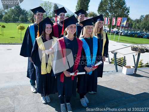 Image of young graduates students group