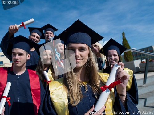 Image of young graduates students group