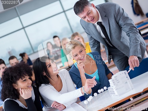 Image of students with teacher  in computer lab classrom