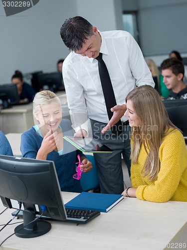 Image of students with teacher  in computer lab classrom