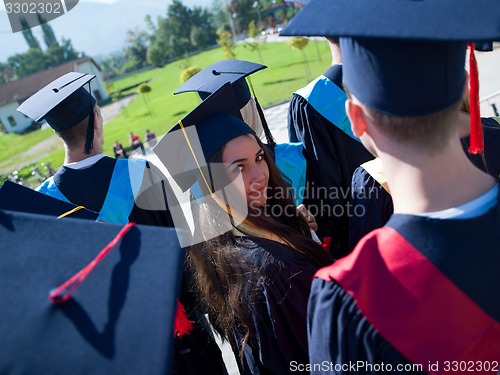 Image of young graduates students group