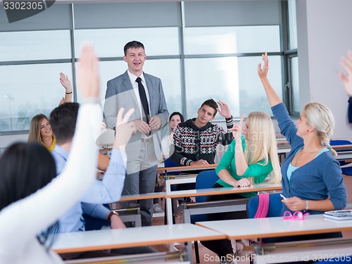 Image of students with teacher  in computer lab classrom