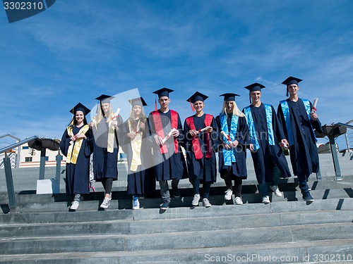 Image of young graduates students group