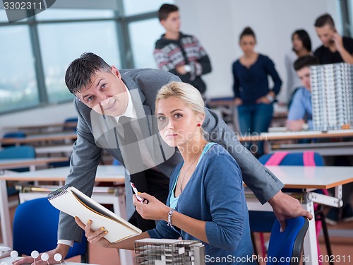 Image of students with teacher  in computer lab classrom