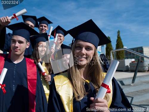 Image of young graduates students group