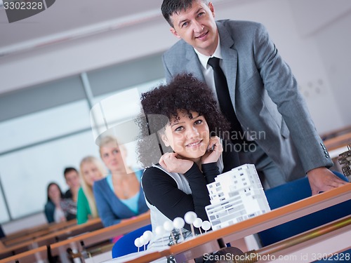 Image of students with teacher  in computer lab classrom
