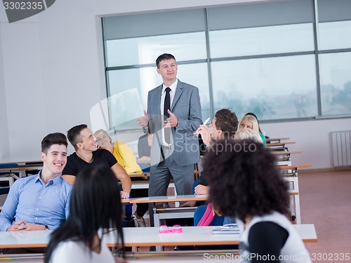 Image of students with teacher  in computer lab classrom