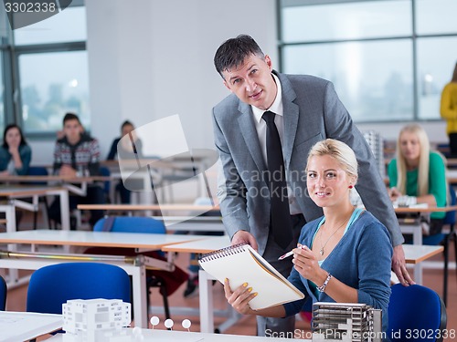 Image of students with teacher  in computer lab classrom