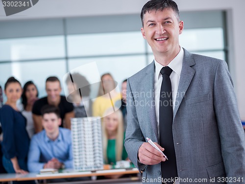 Image of students with teacher  in computer lab classrom