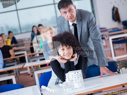 Image of students with teacher  in computer lab classrom