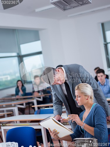 Image of students with teacher  in computer lab classrom