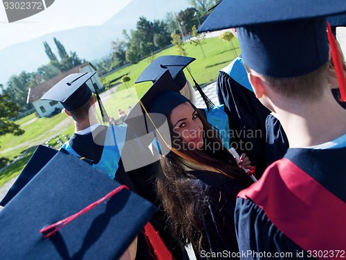 Image of young graduates students group