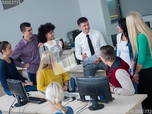 Image of students with teacher  in computer lab classrom