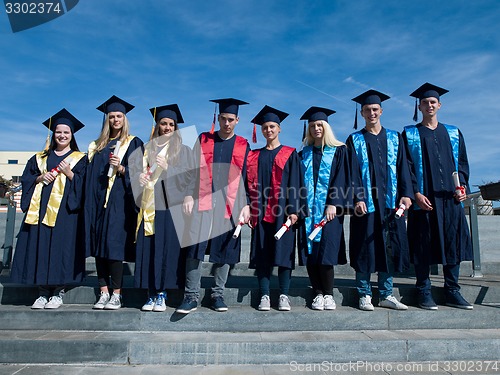 Image of young graduates students group