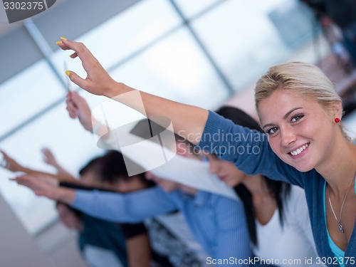 Image of students group raise hands up