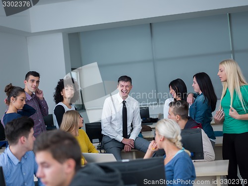 Image of students with teacher  in computer lab classrom