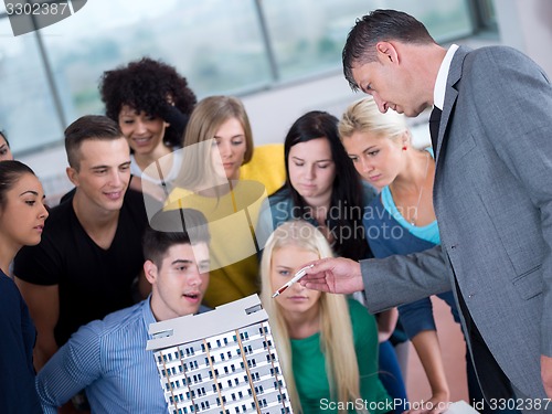 Image of students with teacher  in computer lab classrom