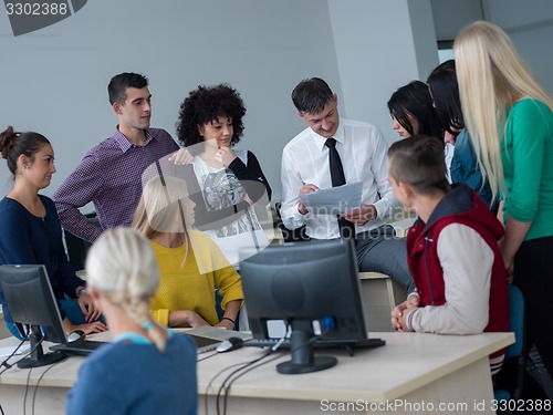 Image of students with teacher  in computer lab classrom