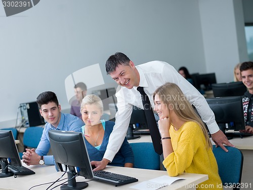 Image of students with teacher  in computer lab classrom