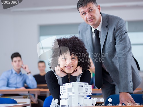 Image of students with teacher  in computer lab classrom