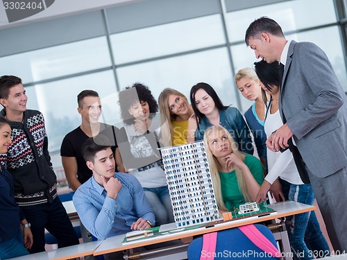 Image of students with teacher  in computer lab classrom