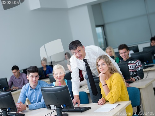 Image of students with teacher  in computer lab classrom