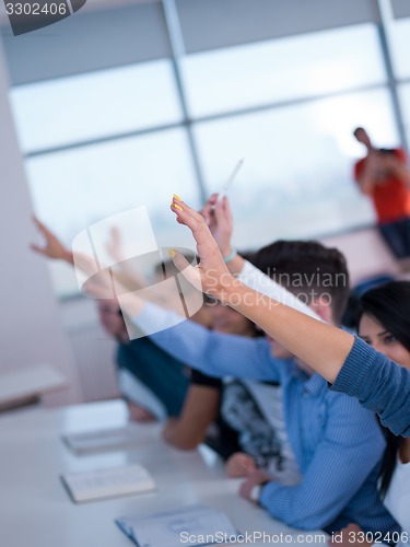 Image of students group raise hands up