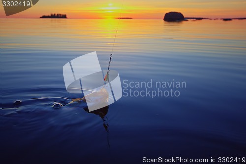 Image of Sunset river perch fishing with the boat and a rod