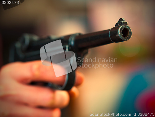 Image of Luger Parabellum automatic pistol in a human hand