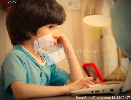 Image of boy with computer