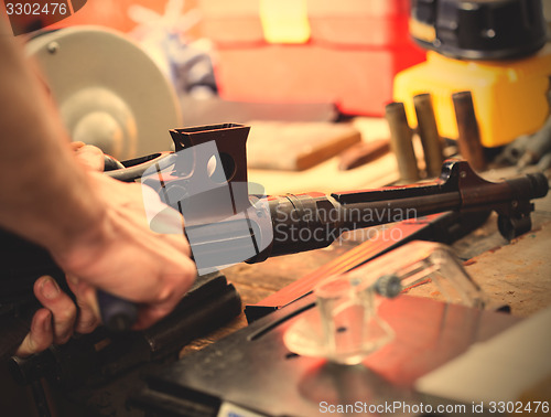 Image of repair of the old German submachine gun MP-38