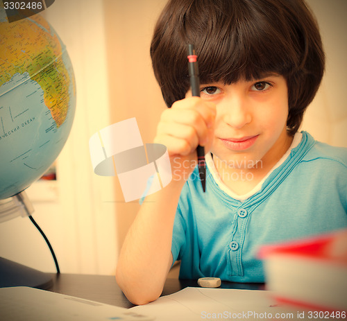 Image of schoolboy doing homework