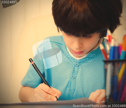 Image of Boy doing homework