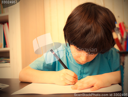 Image of schoolboy doing homework