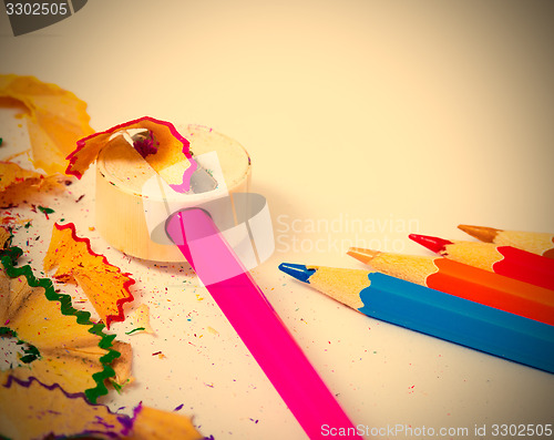 Image of set of colored pencils, sharpener and shavings 