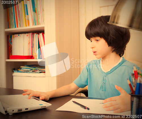Image of schoolboy doing homework