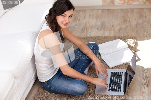 Image of Young woman with notebook