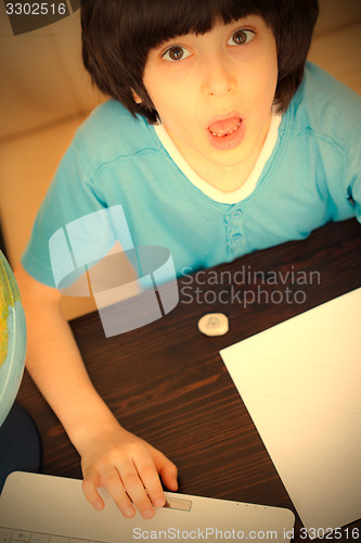 Image of schoolboy doing homework