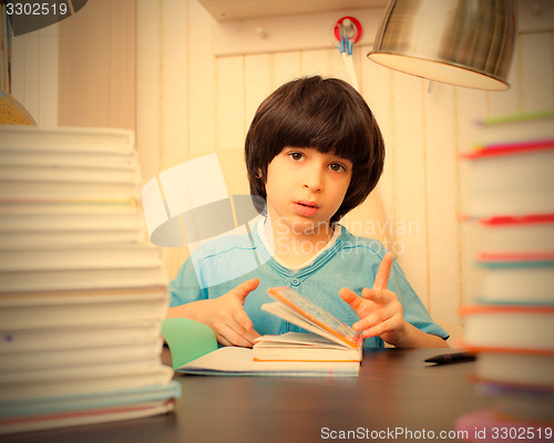 Image of child reading a book