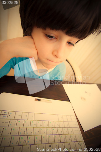 Image of boy with computer