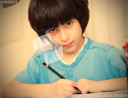 Image of schoolboy doing homework