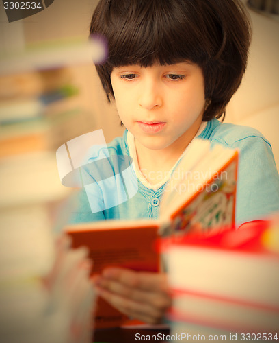 Image of boy reading a book
