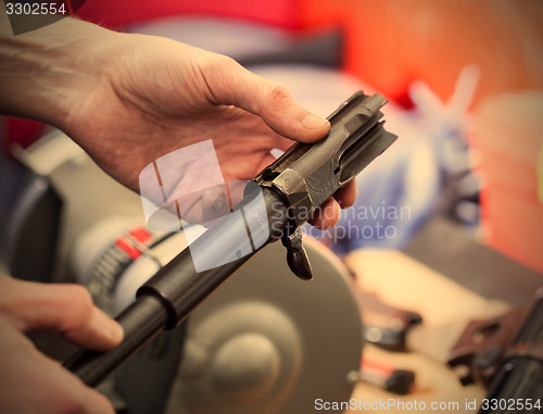 Image of repair of the old German submachine gun MP-38