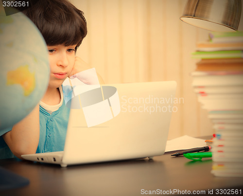 Image of schoolboy doing homework